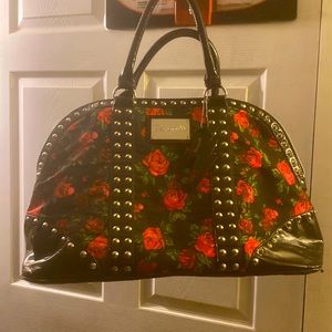 Overnight bag with rose print.